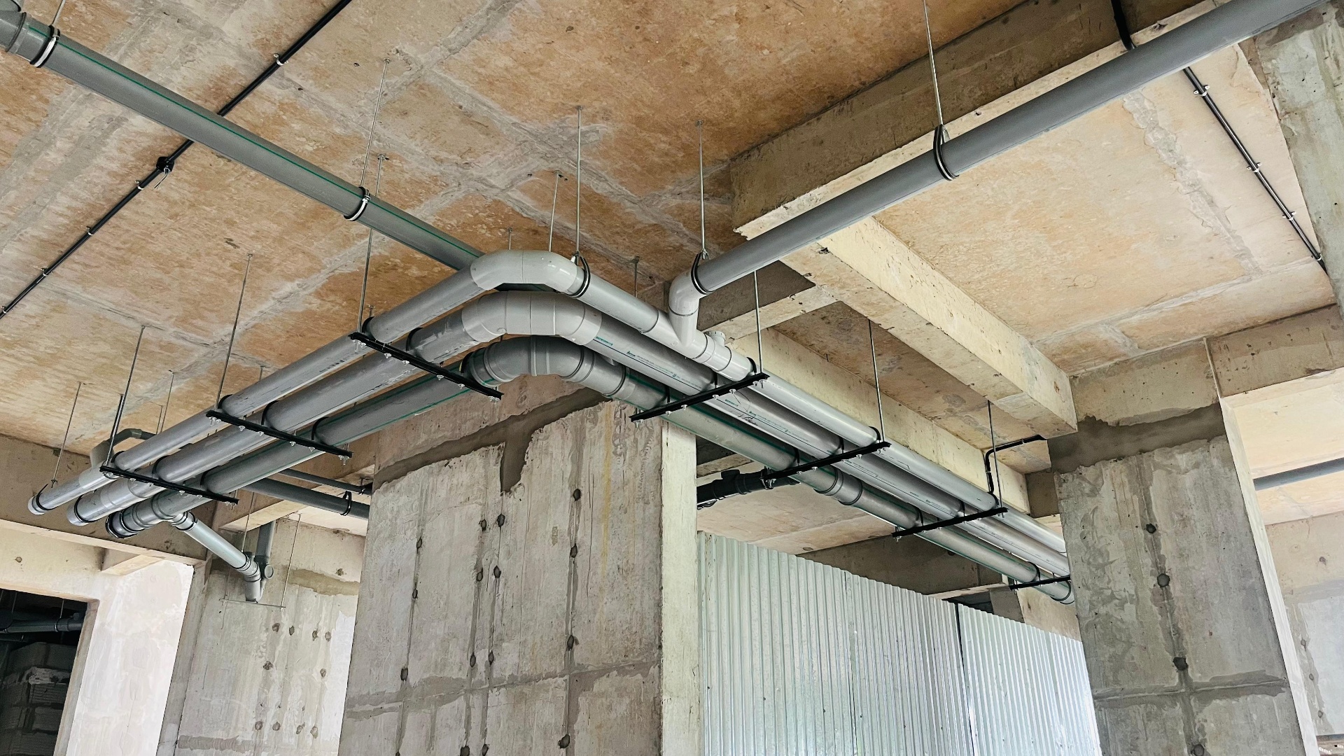 Plumbing pipe network installed under slab