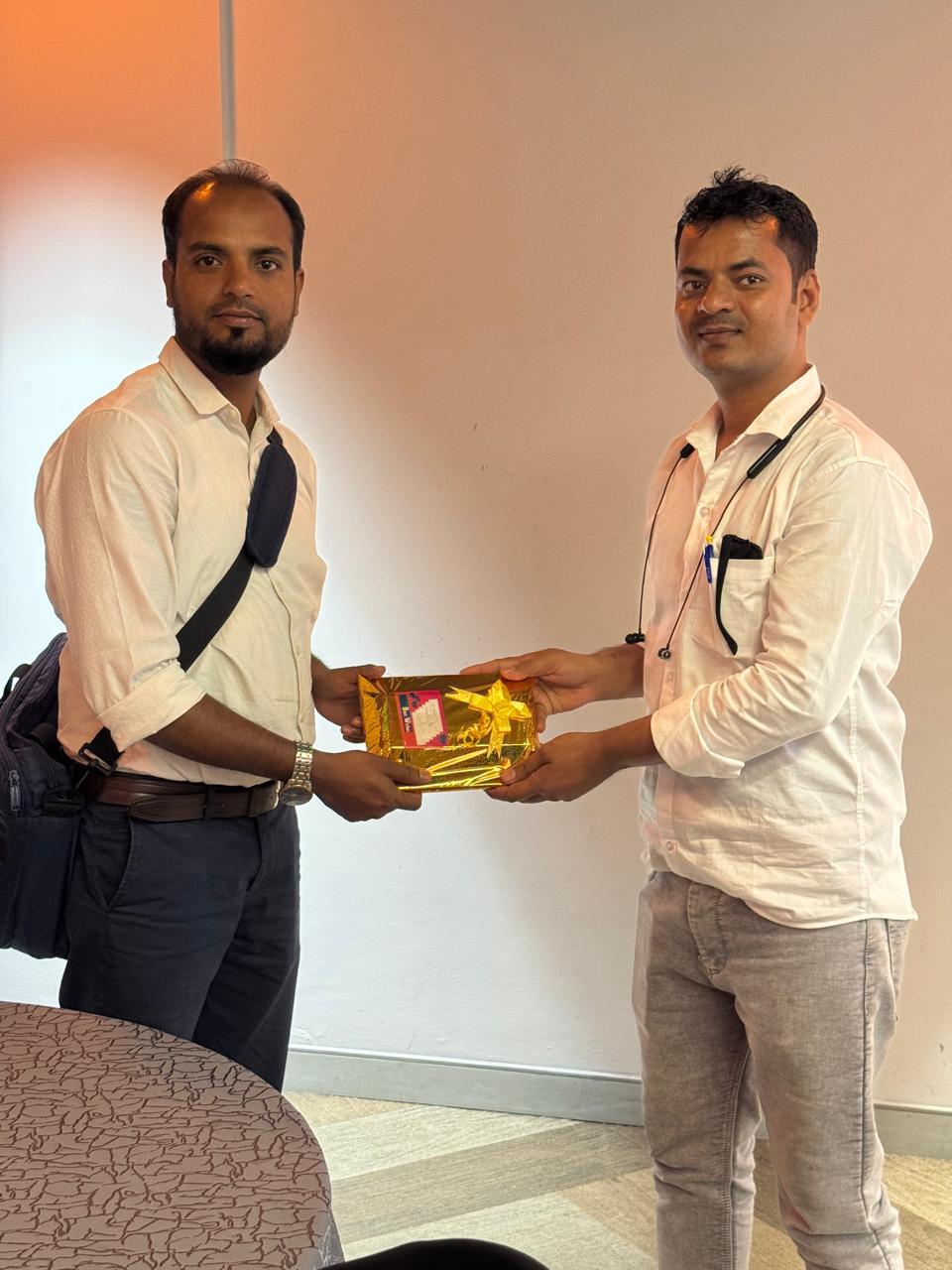 Appreciation gift handover during office event
