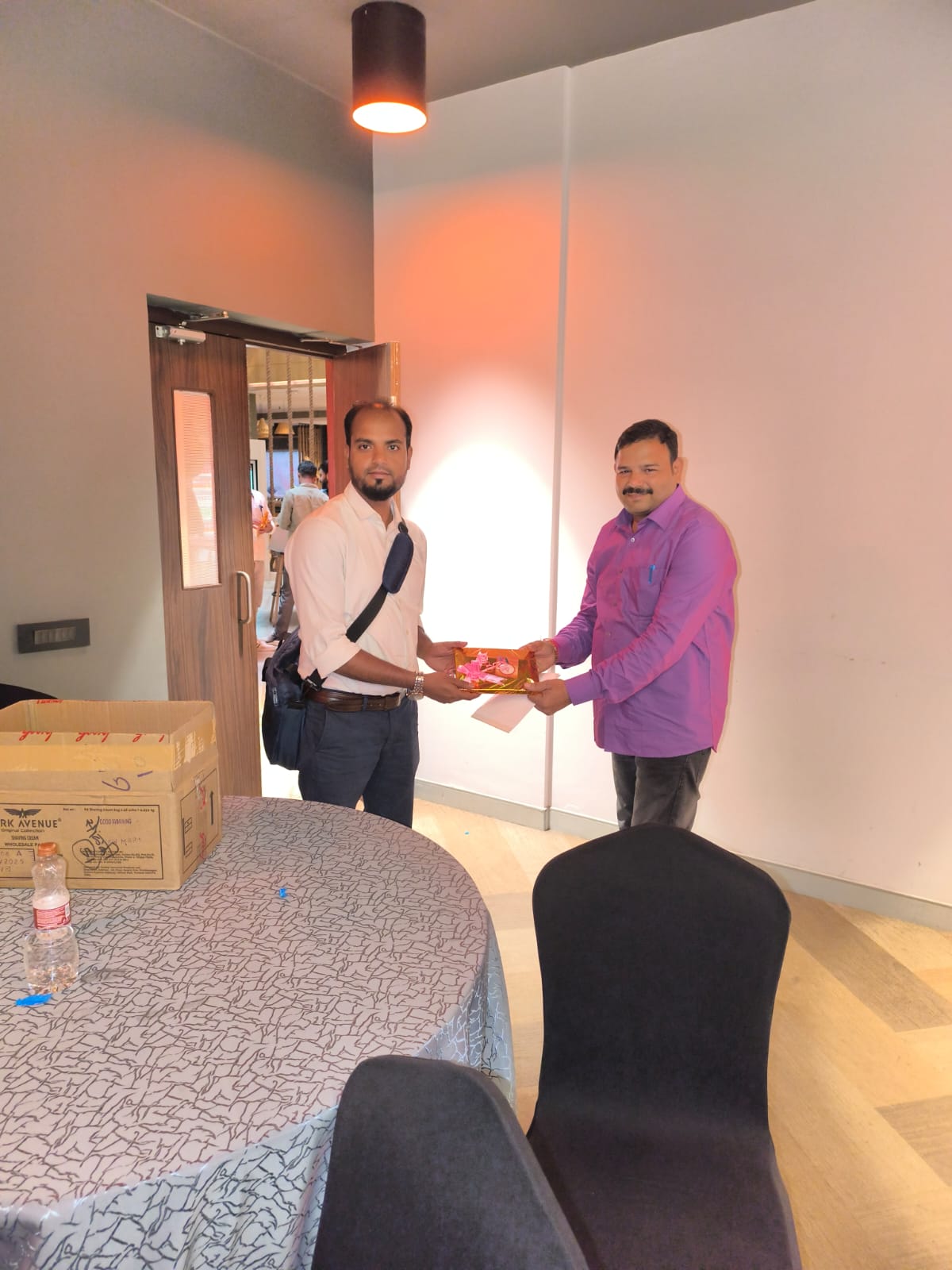 Appreciation gift being presented at office event